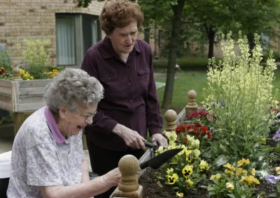 Residents at Delmar Gardens of Overland Park gardening