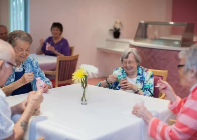 Seniors at the Garden Villas of Lenexa enjoying ice cream from the ice cream parlor