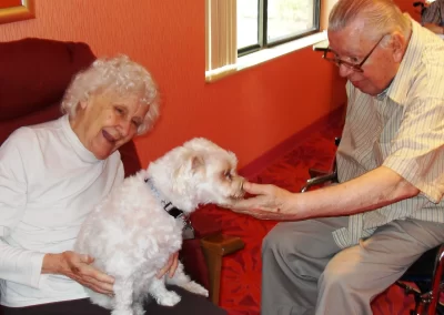 Delmar Gardens of Chesterfield residents holding a dog