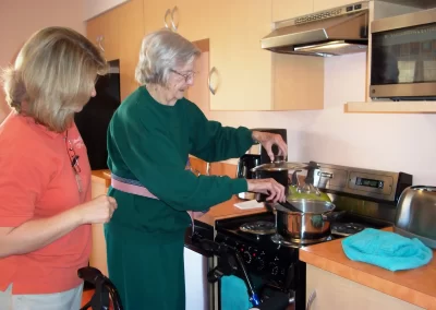 Delmar Gardens of Chesterfield resident cooking in their apartment kitchen