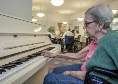 Delmar Gardens of Gwinnett resident playing the piano